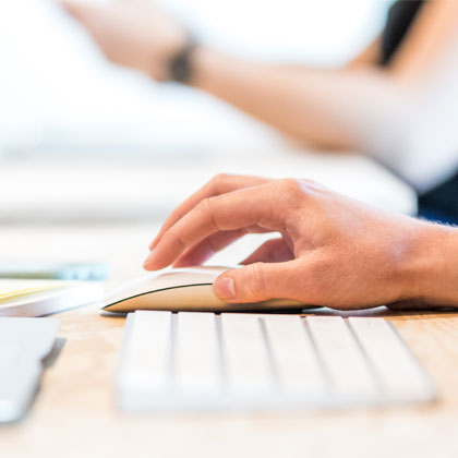 Hand on a computer mouse