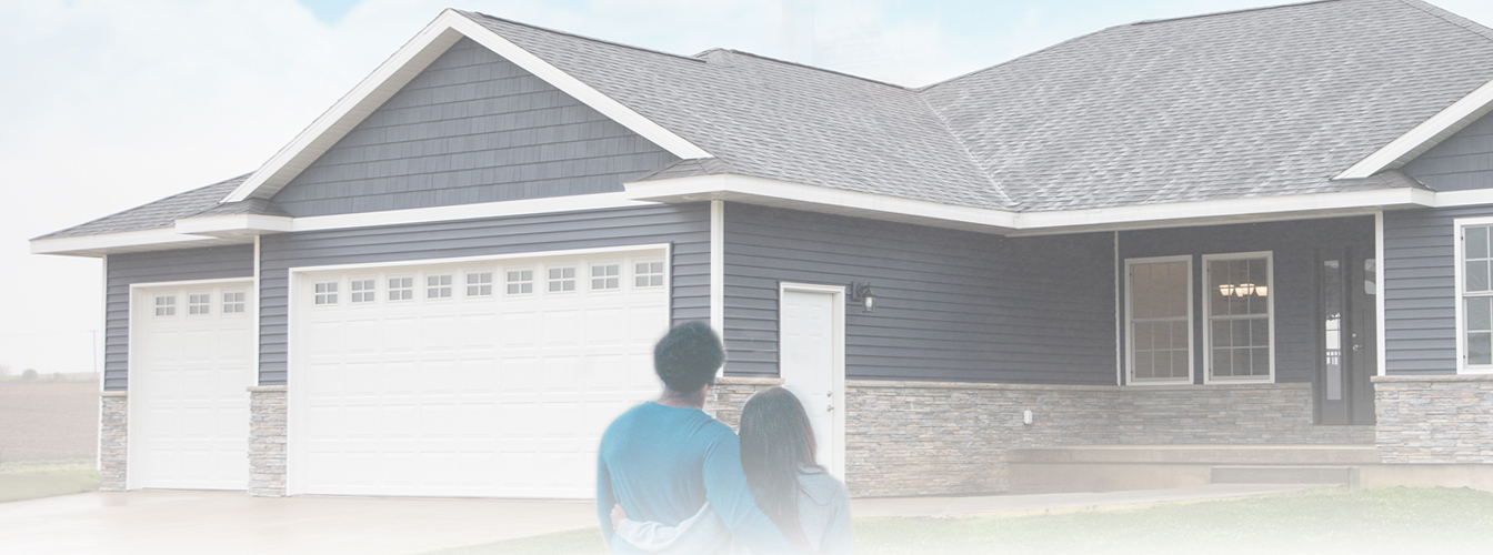 couple in front of house