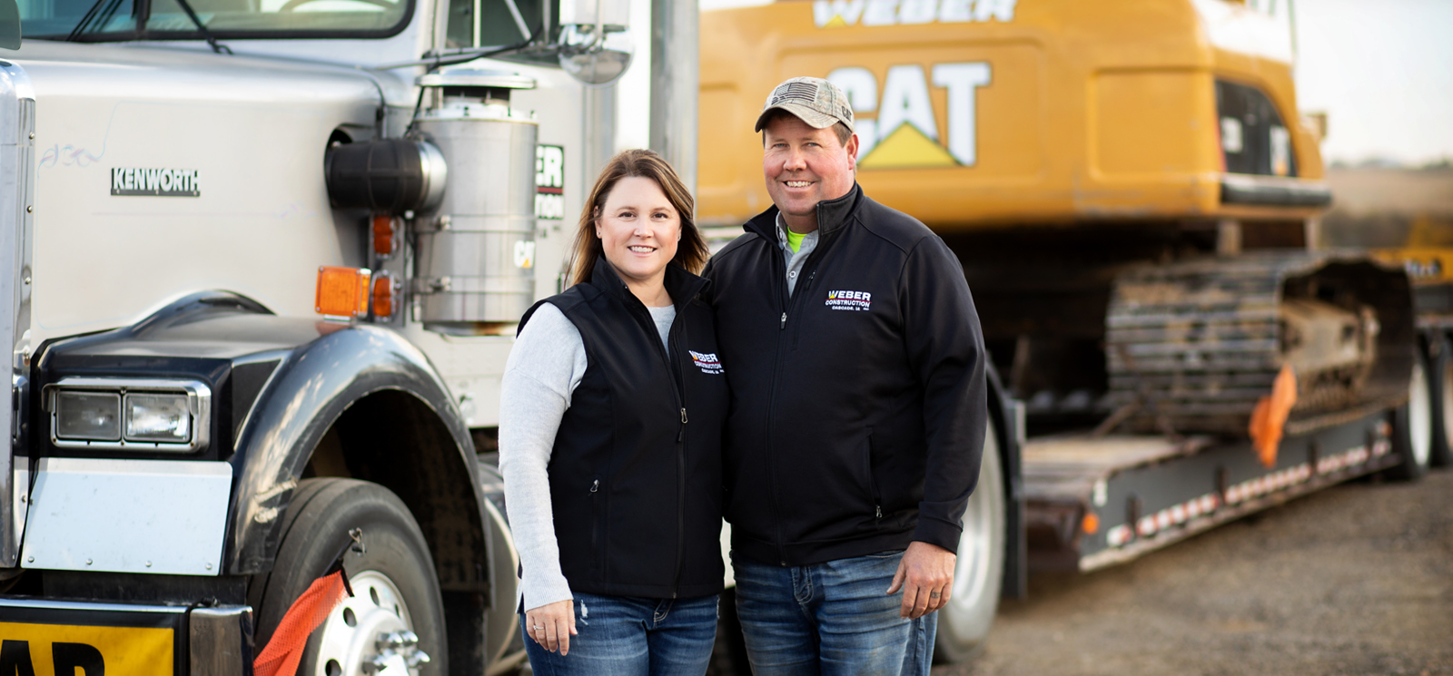 couple in front of equipment