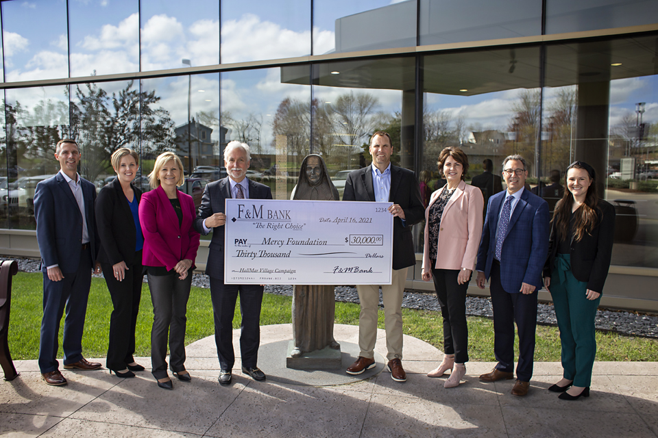 Team with large check