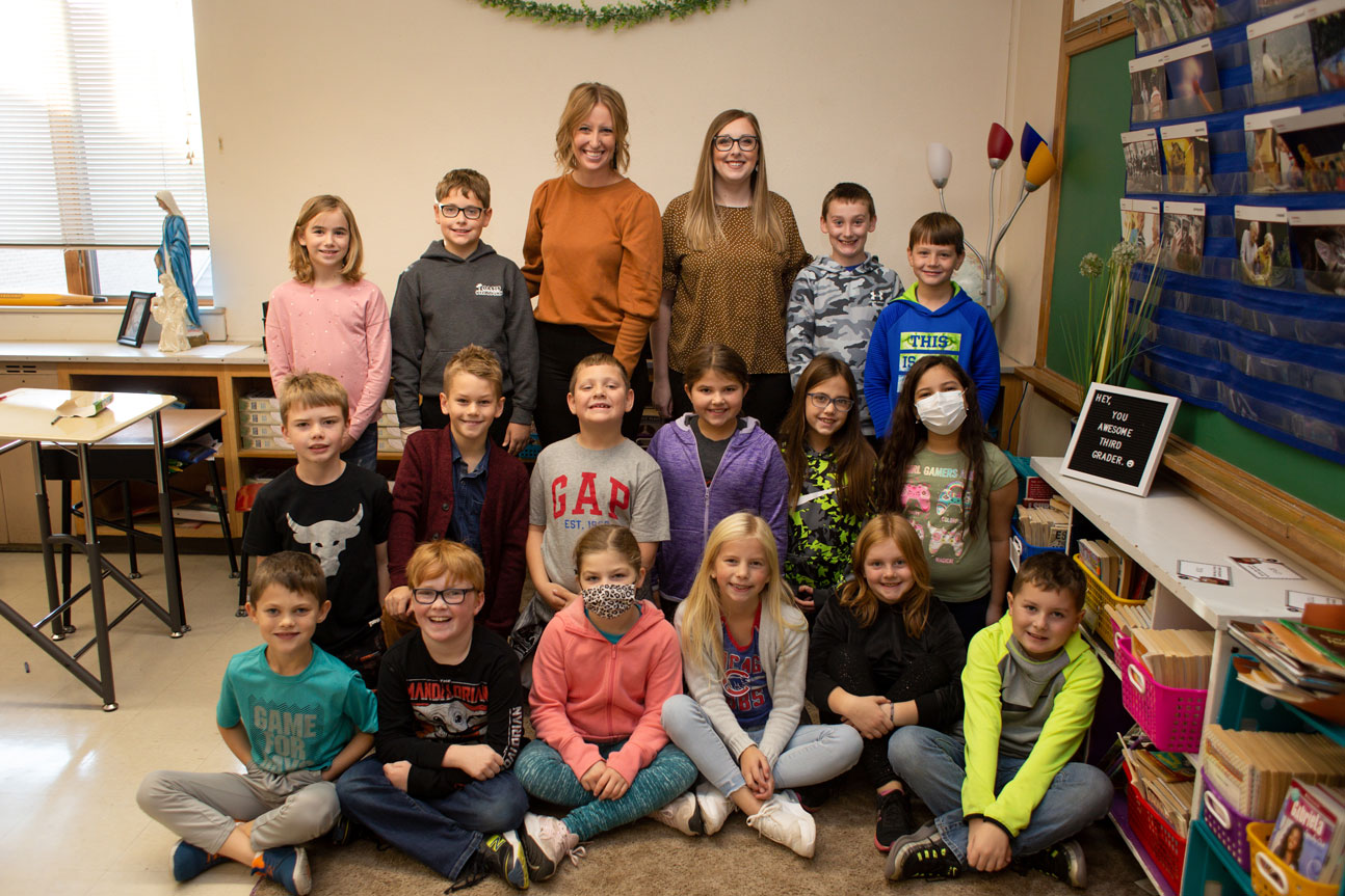 Kids smiling in a classroom